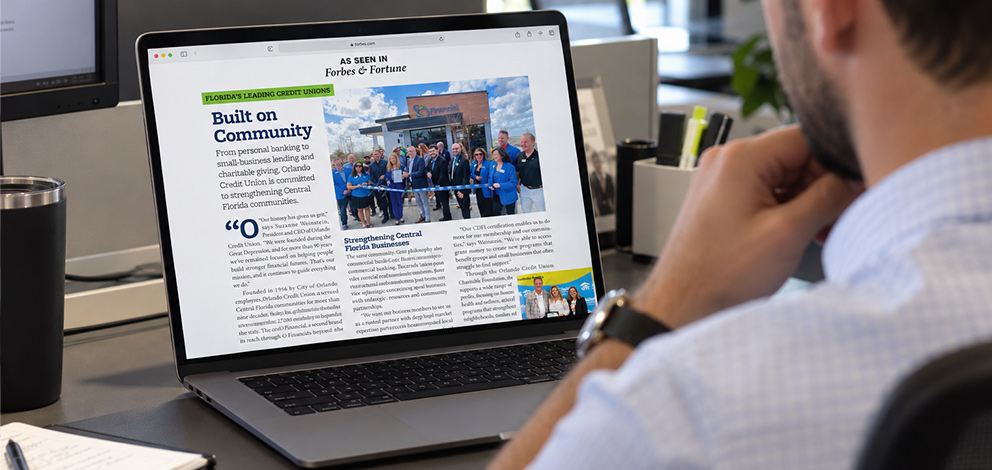Person reading Forbes and Fortune article