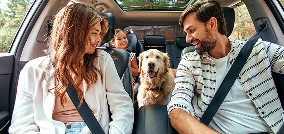 Happy family in their car